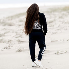 Load image into Gallery viewer, Beckah Shae Black Awake Hoodie and Joggers. The ‘Lion Awake Hoodie’ features a lion face graphic design on the back with the text &quot;Awake&quot; on the right sleeve. Custom Printed on a unisex black hoodie.