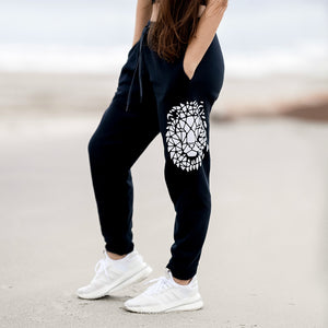 Beckah Shae Black Awake Joggers. The 'Lion Awake Jogger' features pearl white graphics on a premium true black poly/cotton blend jogger that tapers around the leg.
